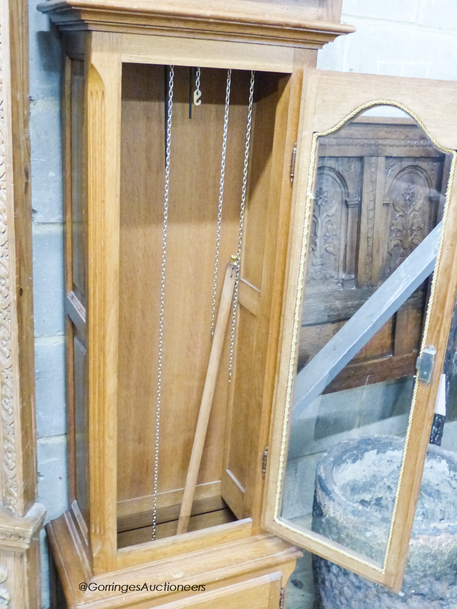 A reproduction oak longcase clock, height 210cm